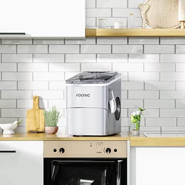 Découvrez notre test complet de la machine à glaçons FOOING : performance 15KG/24H et fonctionnalité auto-nettoyante pour une utilisation simplifiée